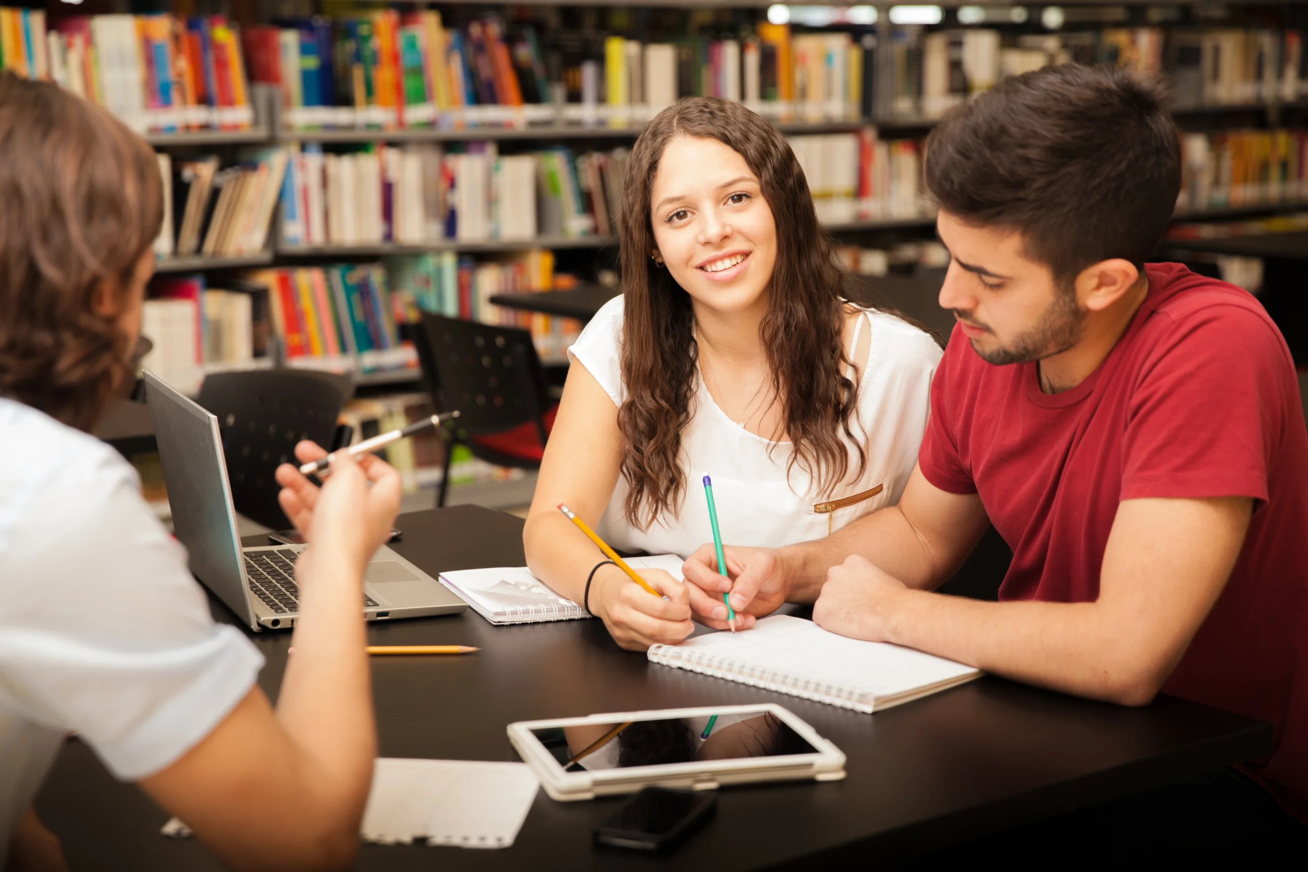 portrait beautiful college student smiling while studying with her friends library scaled